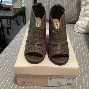 Taupe open toed booties.